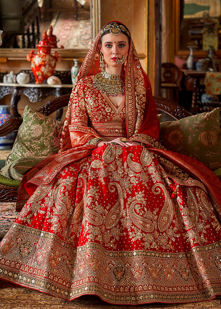 Buy Now Hot Red Silk Heavily Embroidered Bridal Wear Lehenga Choli Online in US, UK, Canada, France, Italy, Germany, Austria, Denmark & Worldwide at Empress.