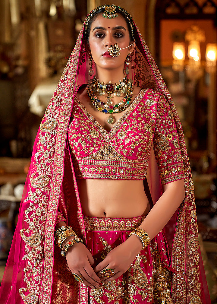 Buy Now Rani Pink Silk Heavily Embroidered Bridal Wear Lehenga Choli Online in US, UK, Canada, France, Italy, Germany, Austria, Denmark & Worldwide at Empress.