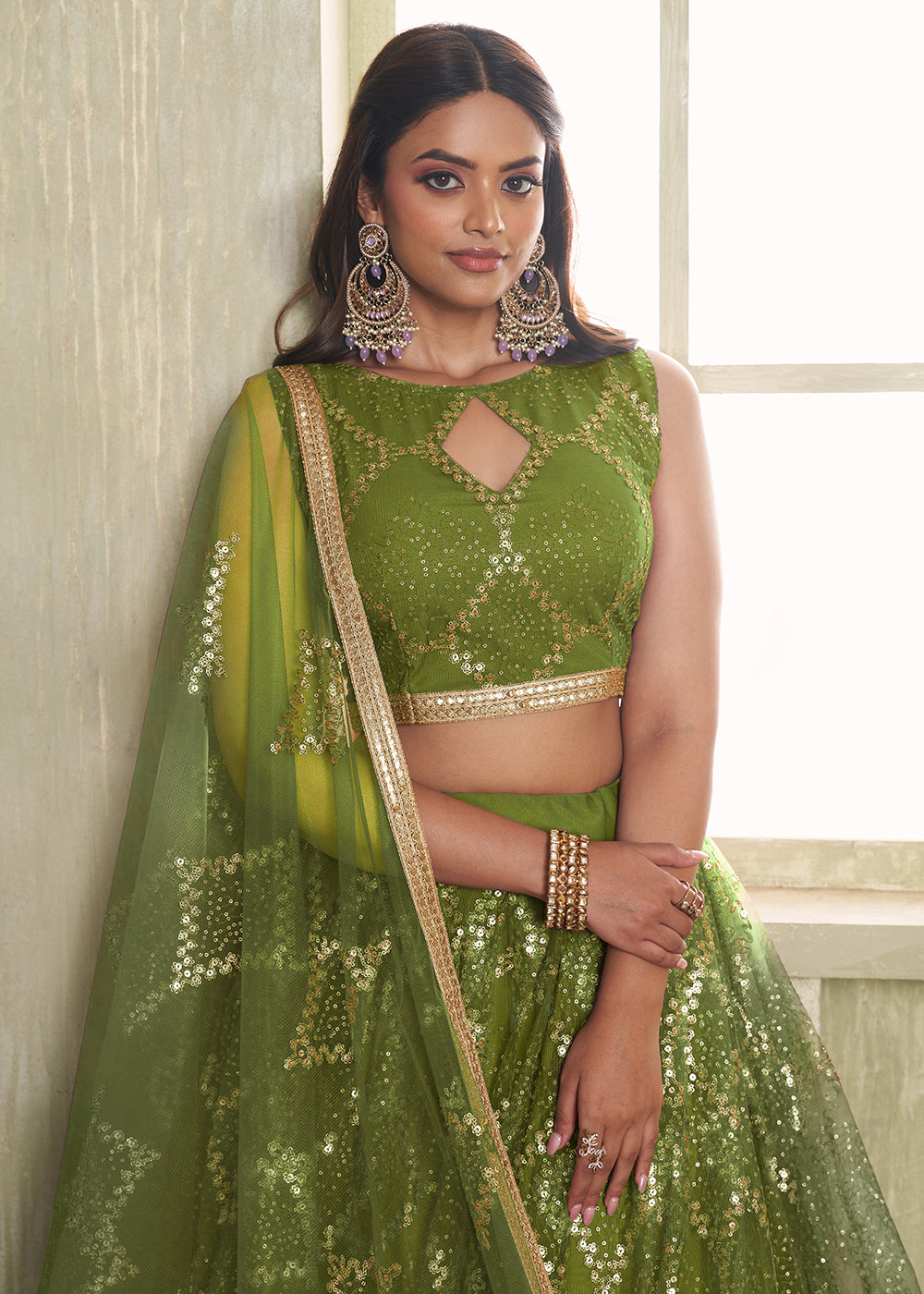 Buy Now Enchanting Green Net Wedding Festive Lehenga Choli Online in USA, UK, Canada, France, Italy, Germany, Sweden, Denmark &amp; Worldwide at Empress Clothing.