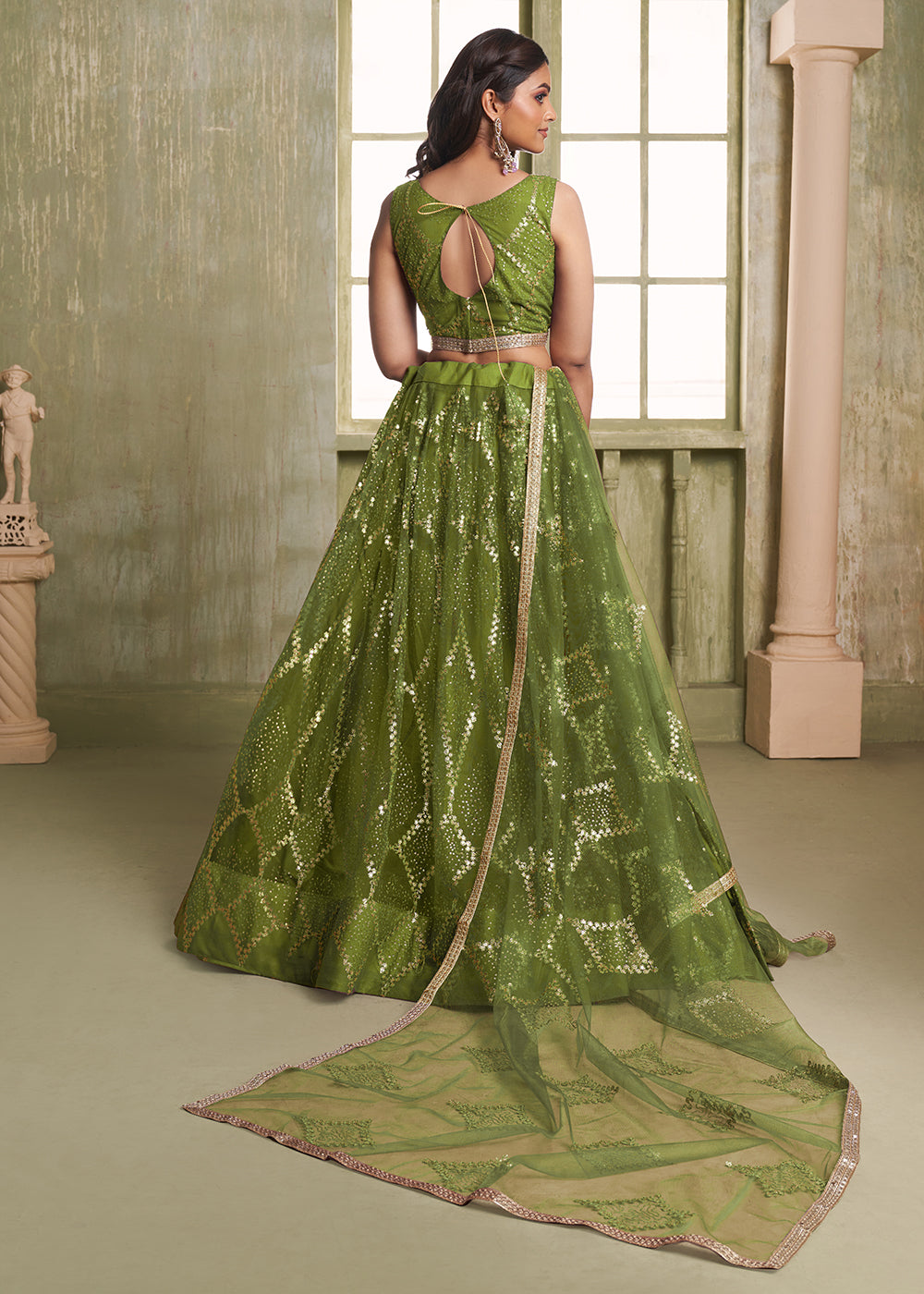 Buy Now Enchanting Green Net Wedding Festive Lehenga Choli Online in USA, UK, Canada, France, Italy, Germany, Sweden, Denmark &amp; Worldwide at Empress Clothing.
