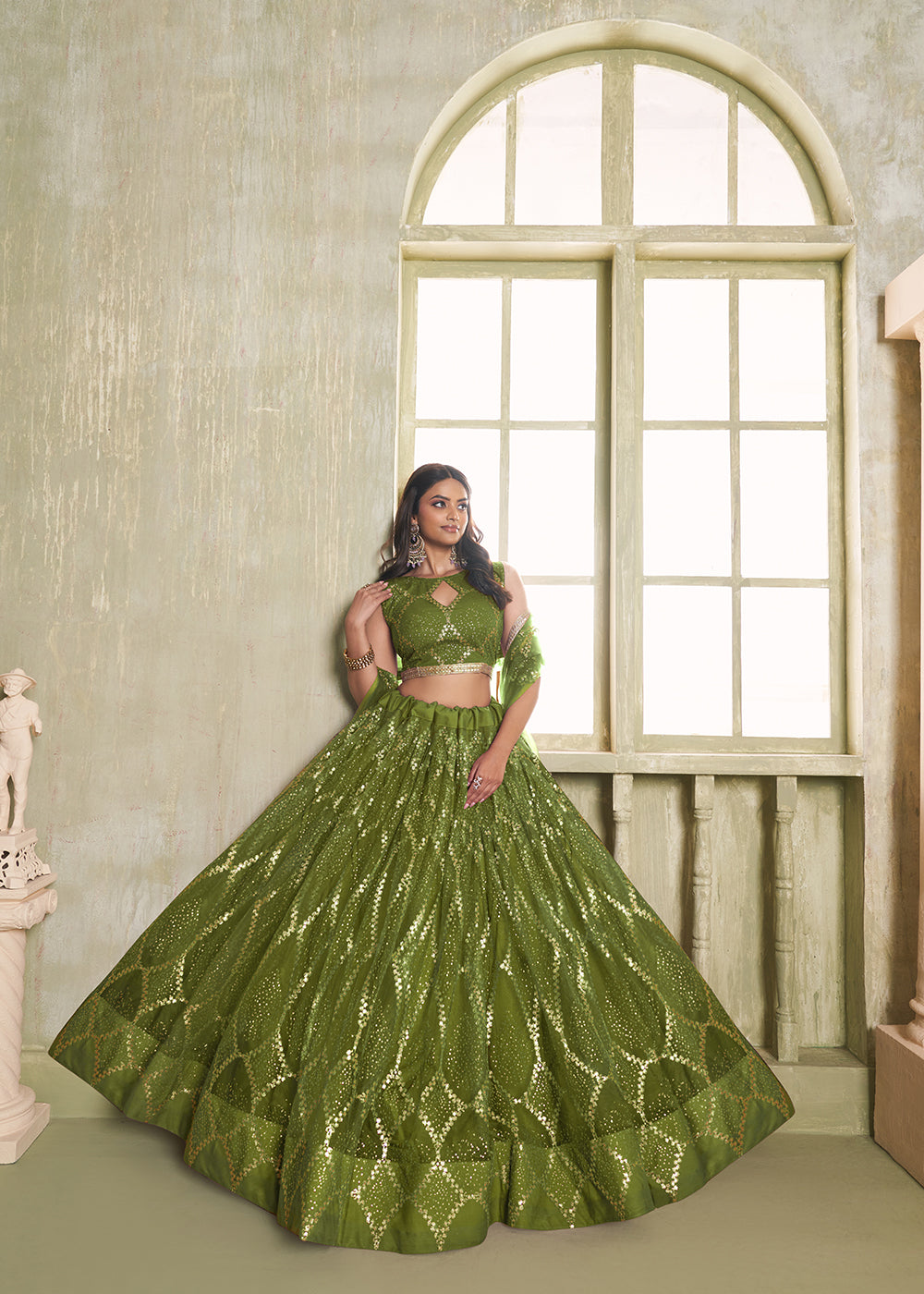 Buy Now Enchanting Green Net Wedding Festive Lehenga Choli Online in USA, UK, Canada, France, Italy, Germany, Sweden, Denmark &amp; Worldwide at Empress Clothing.