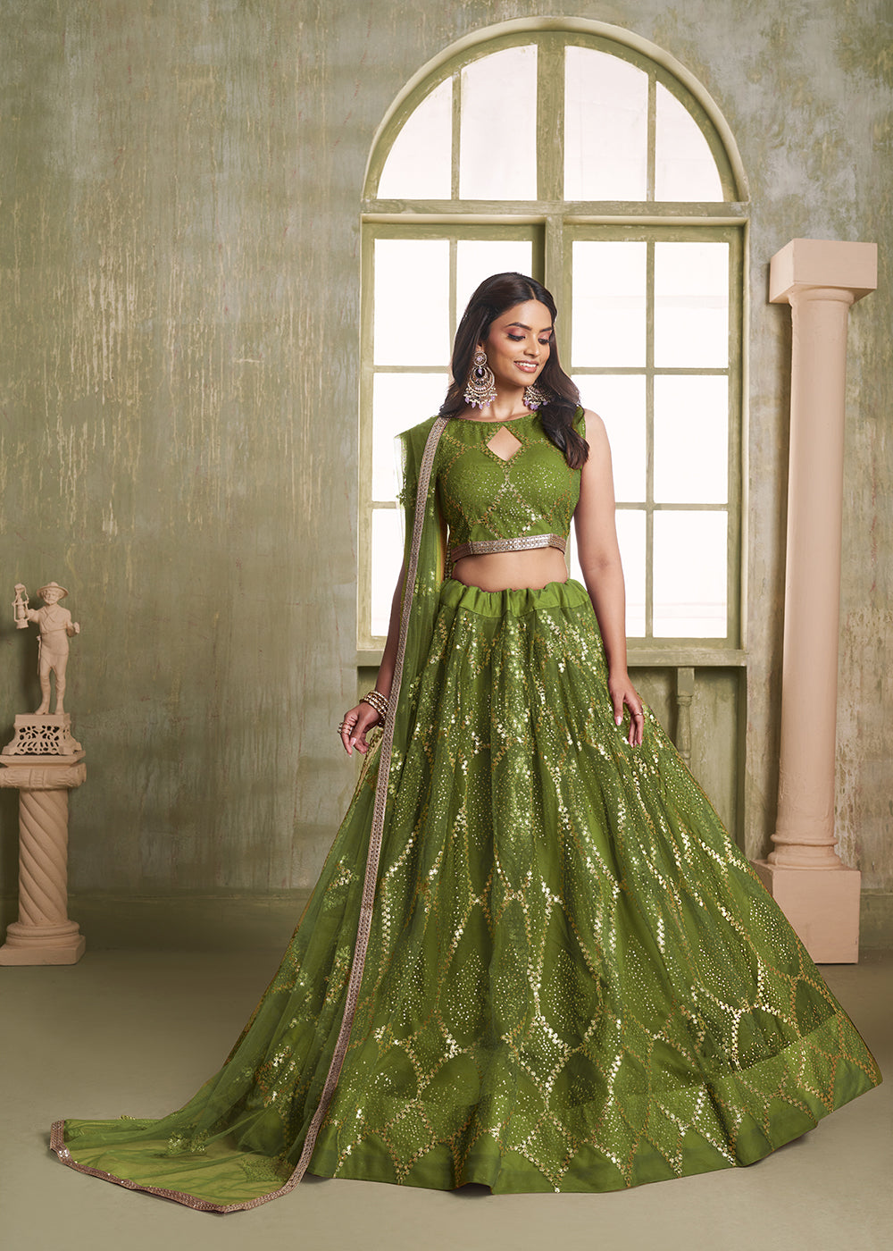 Buy Now Enchanting Green Net Wedding Festive Lehenga Choli Online in USA, UK, Canada, France, Italy, Germany, Sweden, Denmark &amp; Worldwide at Empress Clothing.
