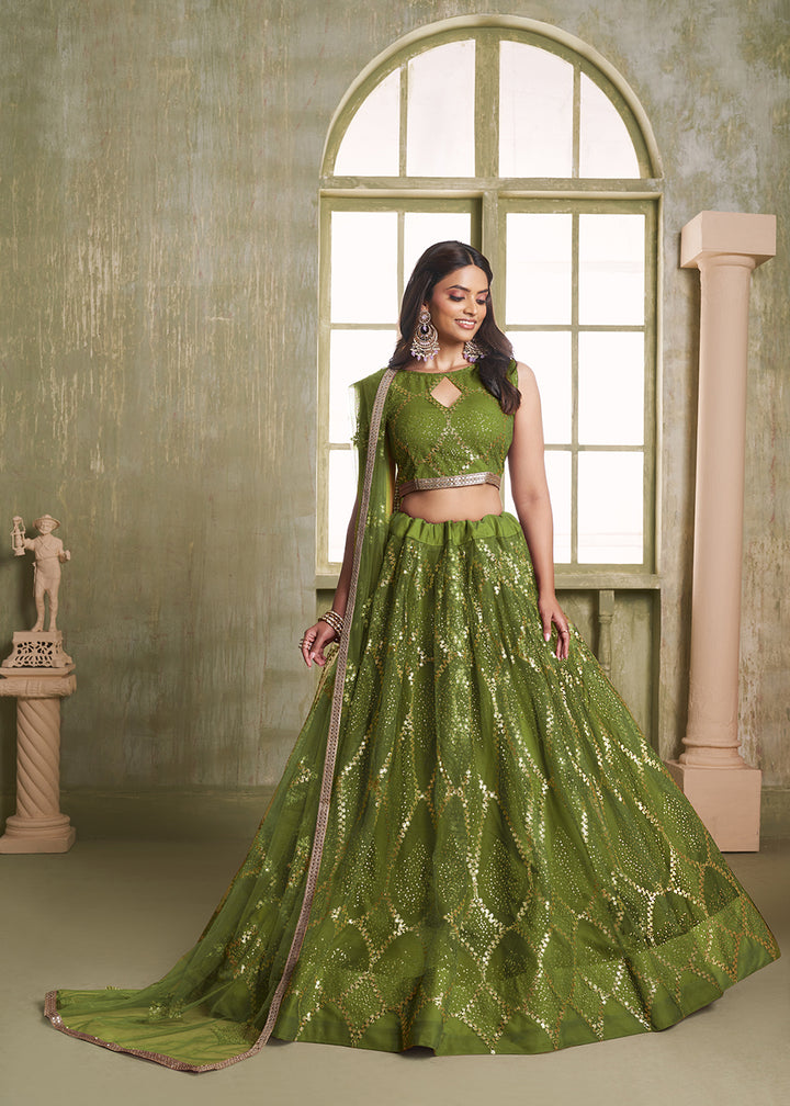 Buy Now Enchanting Green Net Wedding Festive Lehenga Choli Online in USA, UK, Canada, France, Italy, Germany, Sweden, Denmark &amp; Worldwide at Empress Clothing.