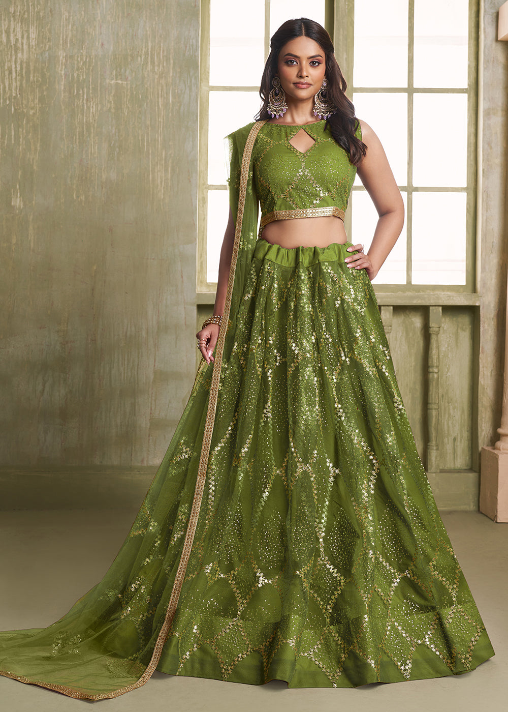 Buy Now Enchanting Green Net Wedding Festive Lehenga Choli Online in USA, UK, Canada, France, Italy, Germany, Sweden, Denmark &amp; Worldwide at Empress Clothing.
