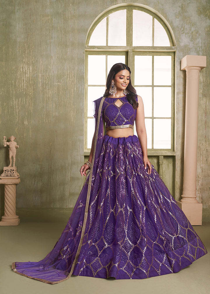 Buy Now Enchanting Purple Net Wedding Festive Lehenga Choli Online in USA, UK, Canada, France, Italy, Germany, Sweden, Denmark &amp; Worldwide at Empress Clothing.