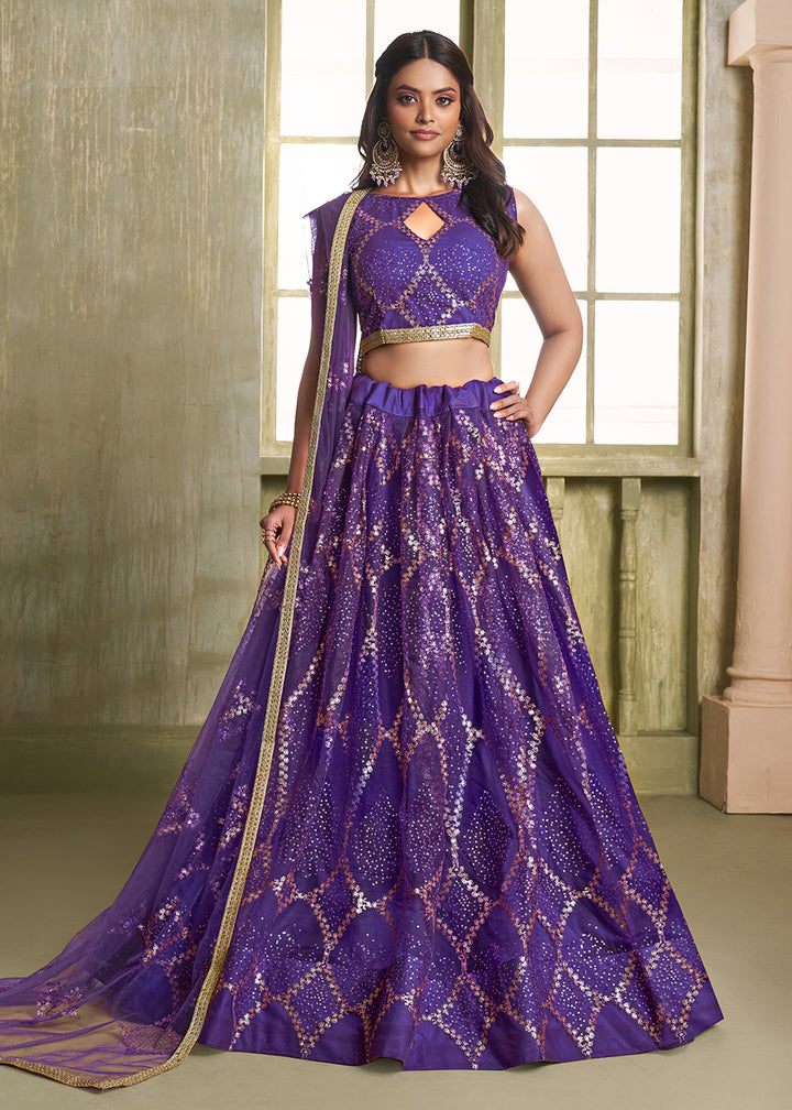 Buy Now Enchanting Purple Net Wedding Festive Lehenga Choli Online in USA, UK, Canada, France, Italy, Germany, Sweden, Denmark &amp; Worldwide at Empress Clothing.
