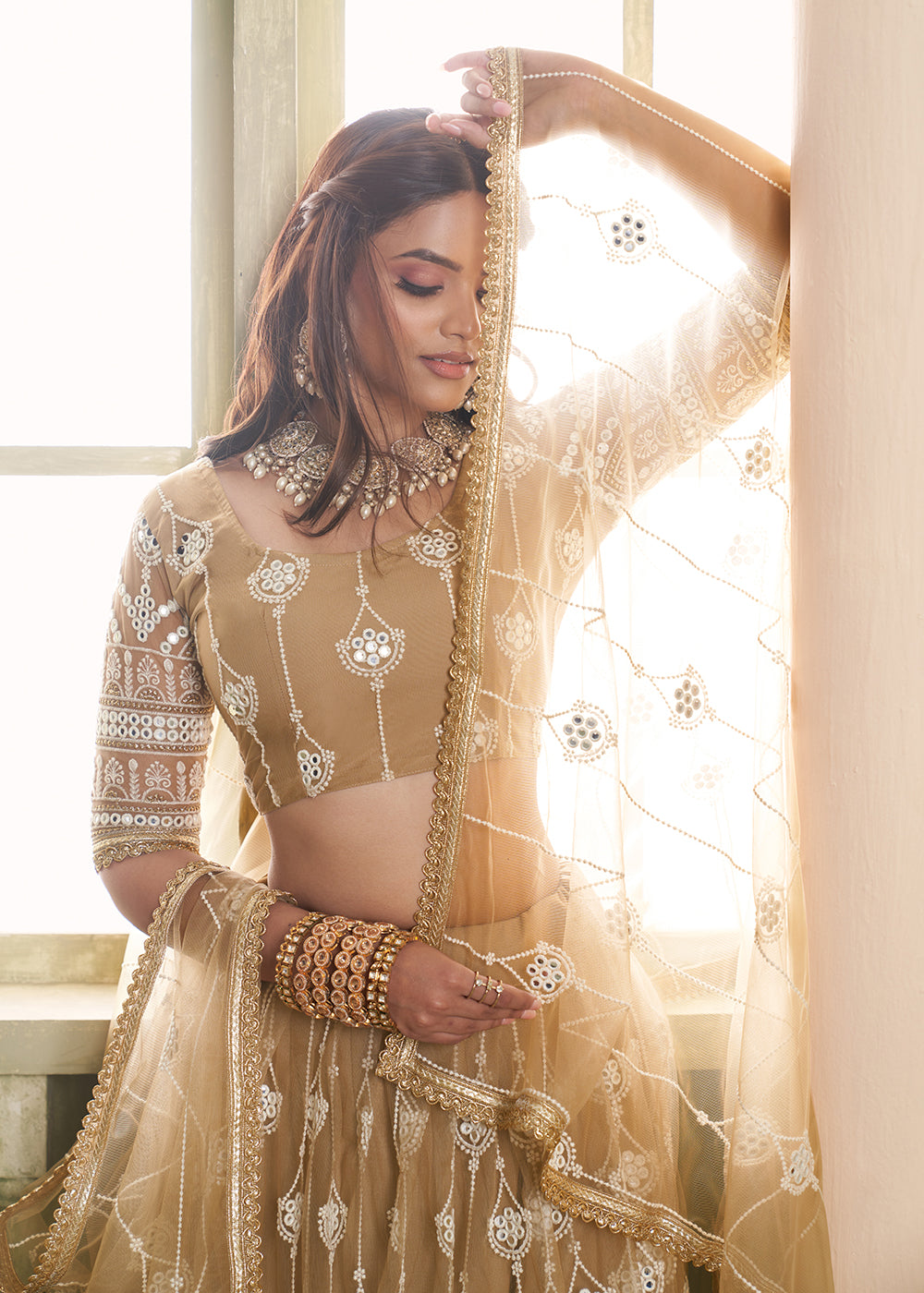 Buy Now Enchanting Beige Net Wedding Festive Lehenga Choli Online in USA, UK, Canada, France, UAE & Worldwide at Empress Clothing.