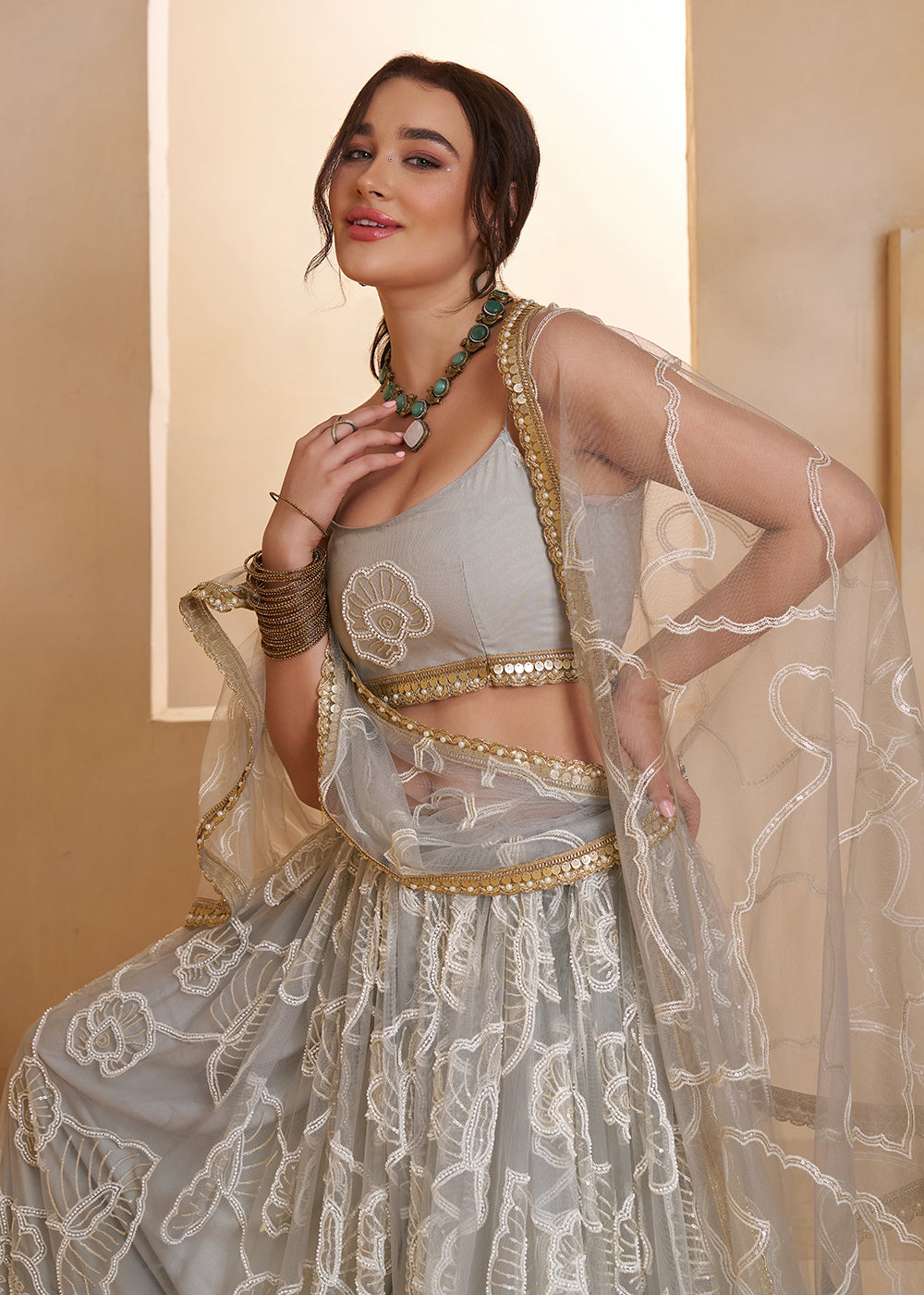 Buy Now Light Grey Beats Embroidery Designer Lehenga Choli Online in US, UK, France, Swiss, Netherlands, Germany, Italy, Canada, UAE & Worldwide at Empress.