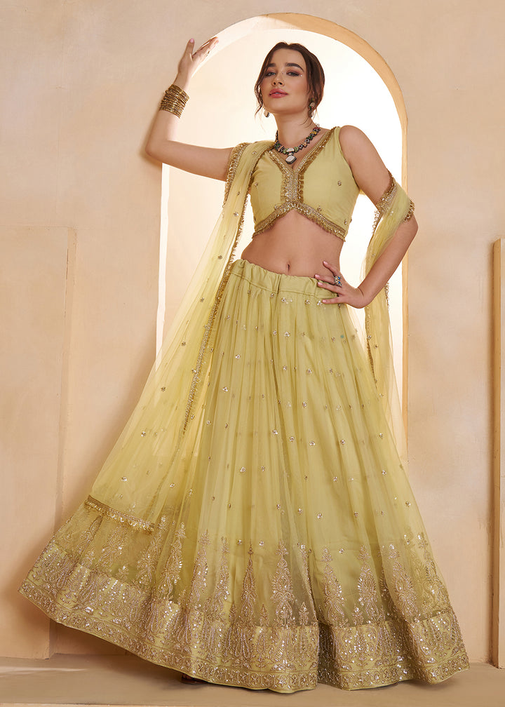 Buy Now Lemon Yellow Beats Embroidery Designer Lehenga Choli Online in US, UK, France, Swiss, Netherlands, Germany, Italy, Canada, UAE & Worldwide at Empress.