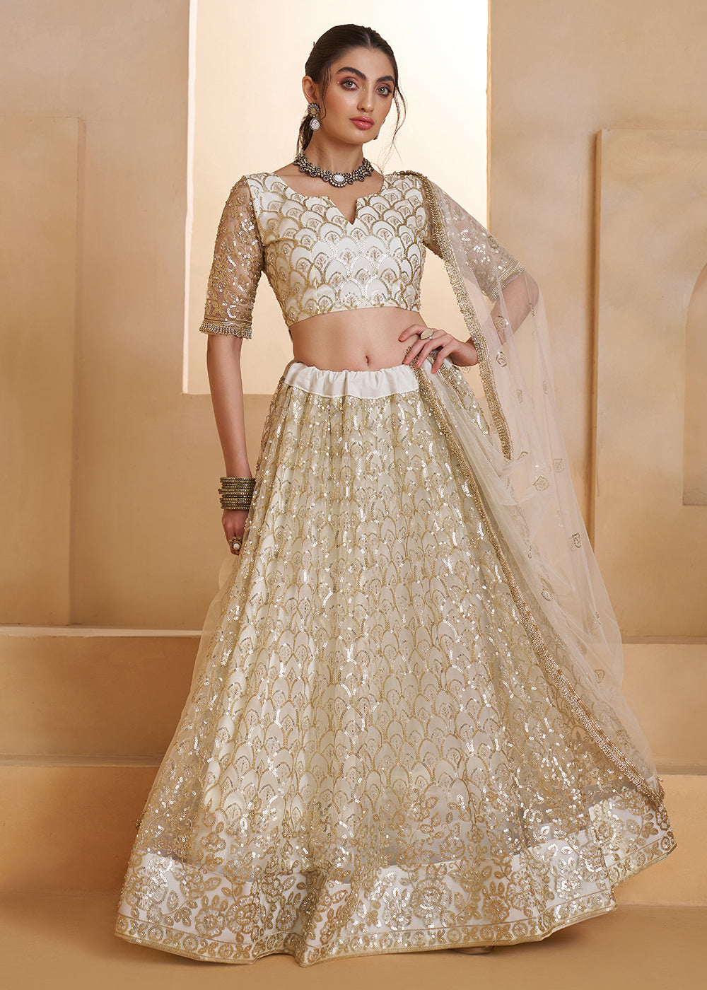 Buy Now Off White Beats Embroidery Designer Lehenga Choli Online in US, UK, France, Swiss, Netherlands, Germany, Italy, Canada, UAE & Worldwide at Empress.