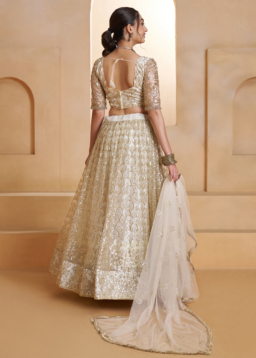 Buy Now Off White Beats Embroidery Designer Lehenga Choli Online in US, UK, France, Swiss, Netherlands, Germany, Italy, Canada, UAE & Worldwide at Empress.