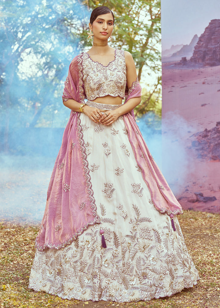 Buy Now Cream & Purple Viscose Embroidered Designer Lehenga Choli Online in USA, UK, Canada, UAE, France, Germany & Worldwide at Empress Clothing. 