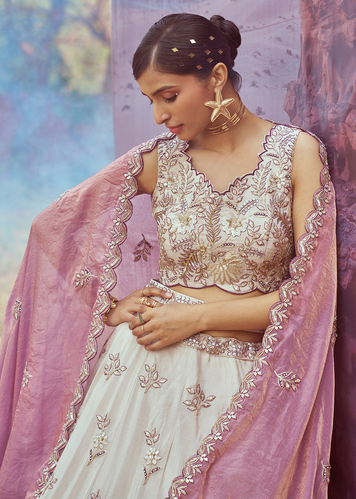 Buy Now Cream & Purple Viscose Embroidered Designer Lehenga Choli Online in USA, UK, Canada, UAE, France, Germany & Worldwide at Empress Clothing. 