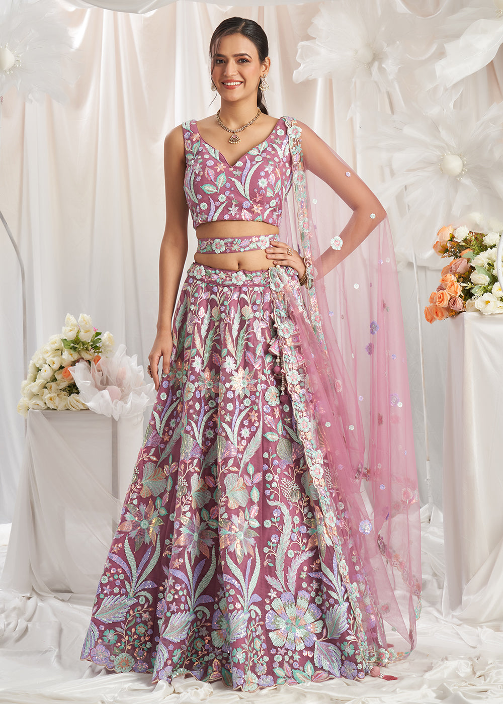 Buy Now Rose Gold Net Floral Embroidered Designer Lehenga Choli Online in USA, UK, Canada, UAE, France, Germany & Worldwide at Empress Clothing.