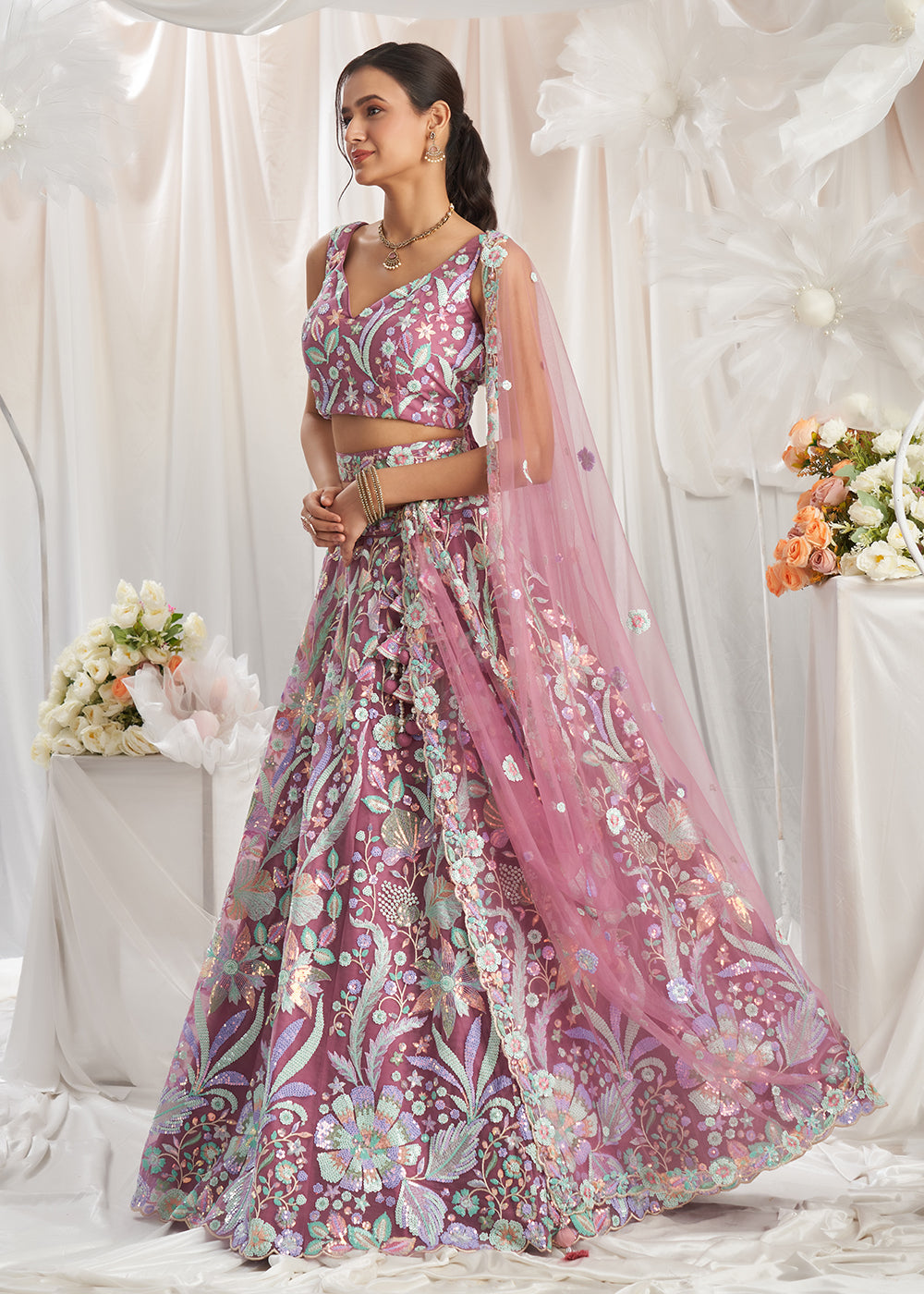 Buy Now Rose Gold Net Floral Embroidered Designer Lehenga Choli Online in USA, UK, Canada, UAE, France, Germany & Worldwide at Empress Clothing.