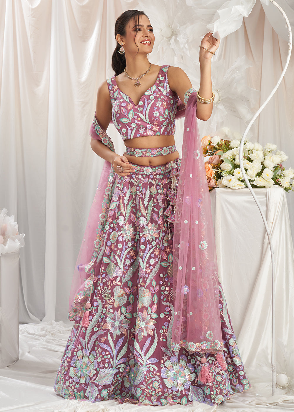 Buy Now Rose Gold Net Floral Embroidered Designer Lehenga Choli Online in USA, UK, Canada, UAE, France, Germany & Worldwide at Empress Clothing.