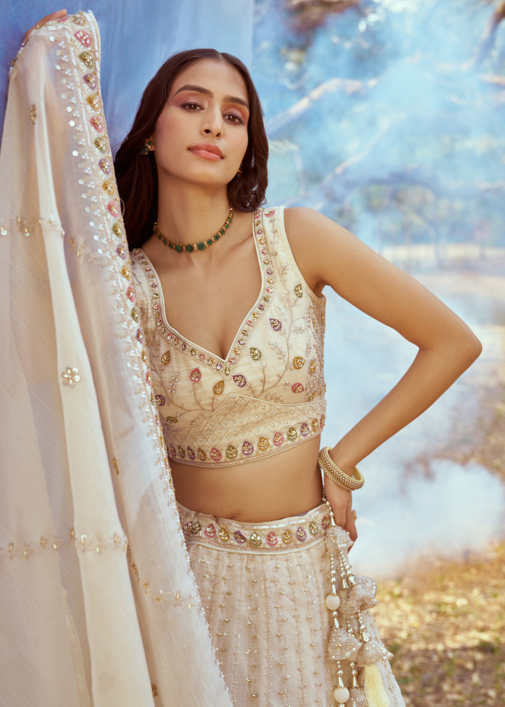 Buy Now Hand Work Embroidered Cream Wedding Lehenga Choli Online in USA, UK, Canada, UAE, France, Germany & Worldwide at Empress Clothing. 