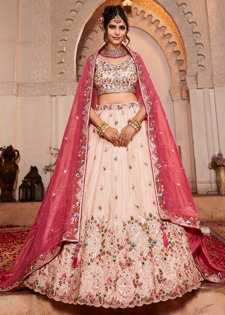 Buy Now Cream & Pink Heavy Embroidered Wedding Lehenga Choli Online in USA, UK, Canada, France, Italy, Germany, Austria, UAE & Worldwide at Empress Clothing.