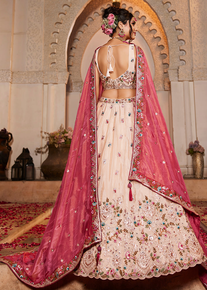 Buy Now Cream & Pink Heavy Embroidered Wedding Lehenga Choli Online in USA, UK, Canada, France, Italy, Germany, Austria, UAE & Worldwide at Empress Clothing.