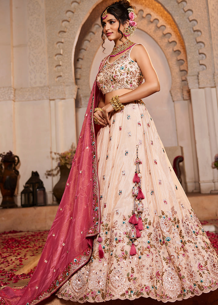 Buy Now Cream & Pink Heavy Embroidered Wedding Lehenga Choli Online in USA, UK, Canada, France, Italy, Germany, Austria, UAE & Worldwide at Empress Clothing.