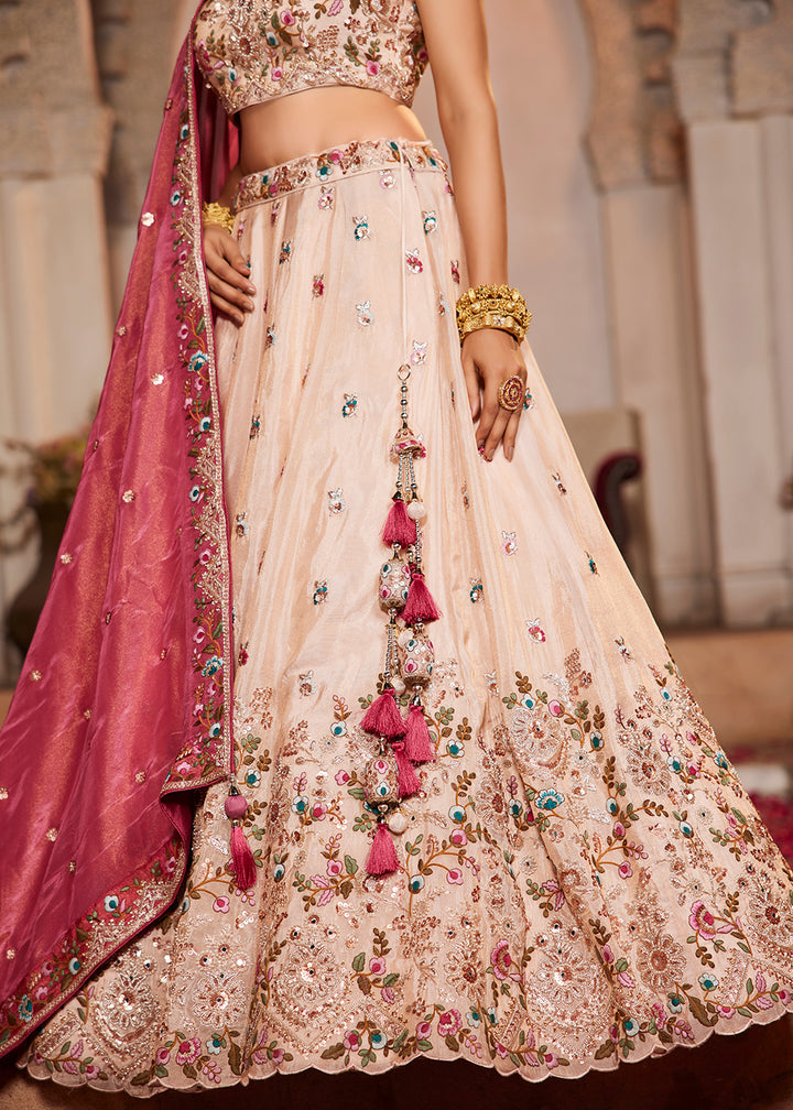 Buy Now Cream & Pink Heavy Embroidered Wedding Lehenga Choli Online in USA, UK, Canada, France, Italy, Germany, Austria, UAE & Worldwide at Empress Clothing.