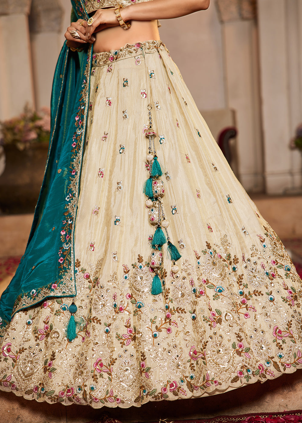 Buy Now Cream & Teal Heavy Embroidered Wedding Lehenga Choli Online in USA, UK, Canada, France, Italy, Germany, Austria, UAE & Worldwide at Empress Clothing.