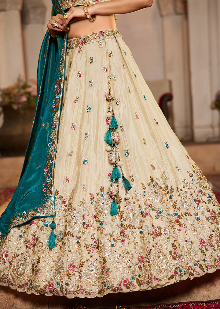 Buy Now Cream & Teal Heavy Embroidered Wedding Lehenga Choli Online in USA, UK, Canada, France, Italy, Germany, Austria, UAE & Worldwide at Empress Clothing.