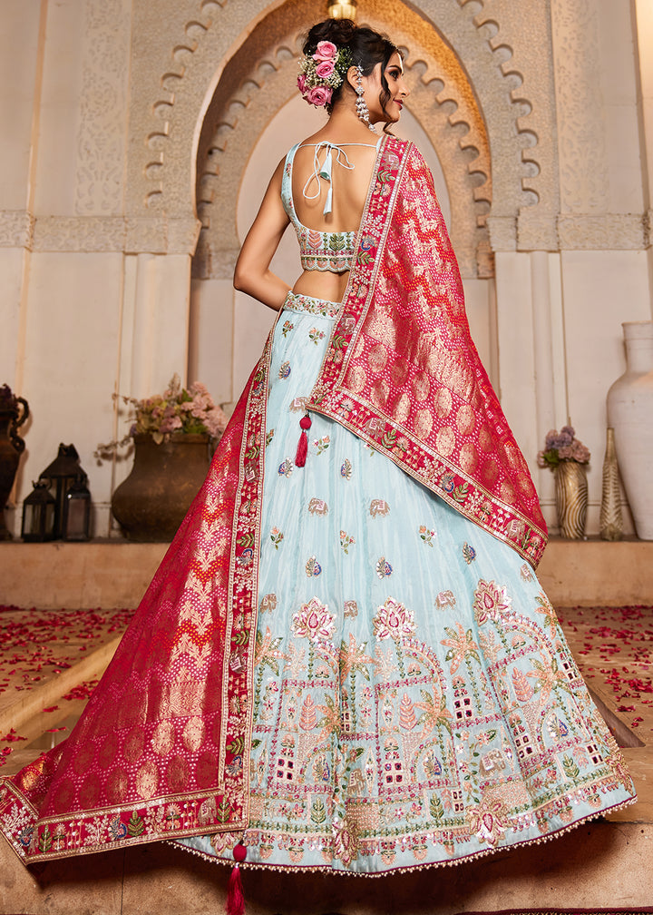Buy Now Blue Tissue Mirror Embroidered Designer Lehenga Choli Online in USA, UK, Canada, France, Italy, Germany, Austria, UAE & Worldwide at Empress Clothing.