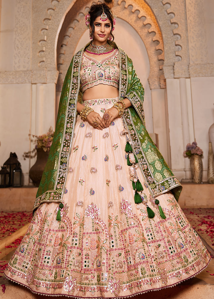 Buy Now Peach Tissue Mirror Embroidered Designer Lehenga Choli Online in USA, UK, Canada, France, Italy, Germany, Austria, UAE & Worldwide at Empress Clothing.