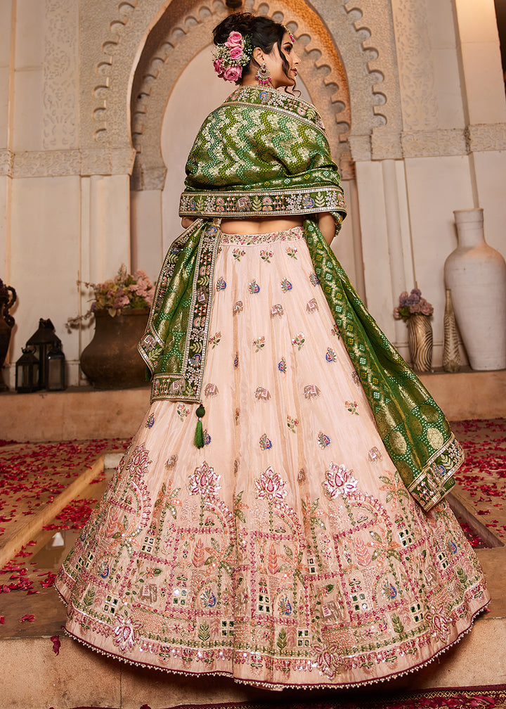 Buy Now Peach Tissue Mirror Embroidered Designer Lehenga Choli Online in USA, UK, Canada, France, Italy, Germany, Austria, UAE & Worldwide at Empress Clothing.
