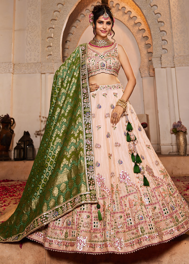 Buy Now Peach Tissue Mirror Embroidered Designer Lehenga Choli Online in USA, UK, Canada, France, Italy, Germany, Austria, UAE & Worldwide at Empress Clothing.