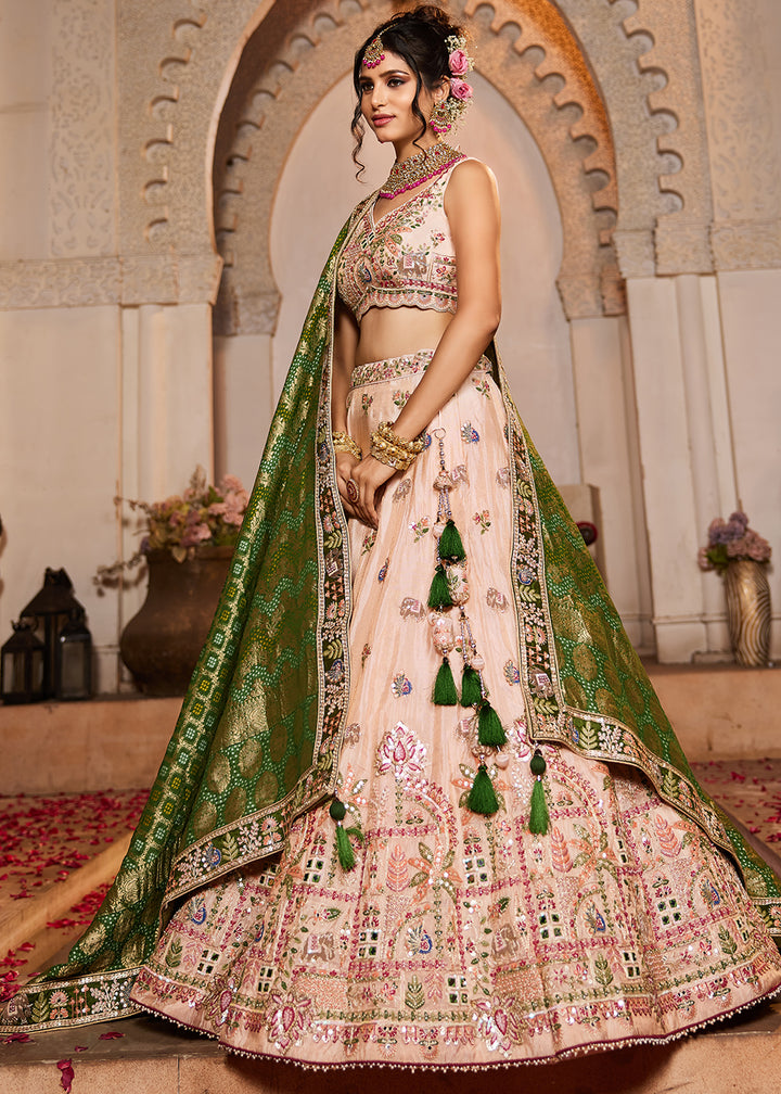 Buy Now Peach Tissue Mirror Embroidered Designer Lehenga Choli Online in USA, UK, Canada, France, Italy, Germany, Austria, UAE & Worldwide at Empress Clothing.