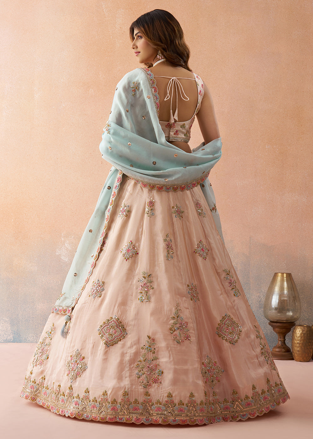 Buy Now Peach Tissue Sequins & Zari Embroidery Lehenga Choli Online in US, UK, Canada, France, Italy, Germany, Sweden, Denmark, UAE & Worldwide at Empress.