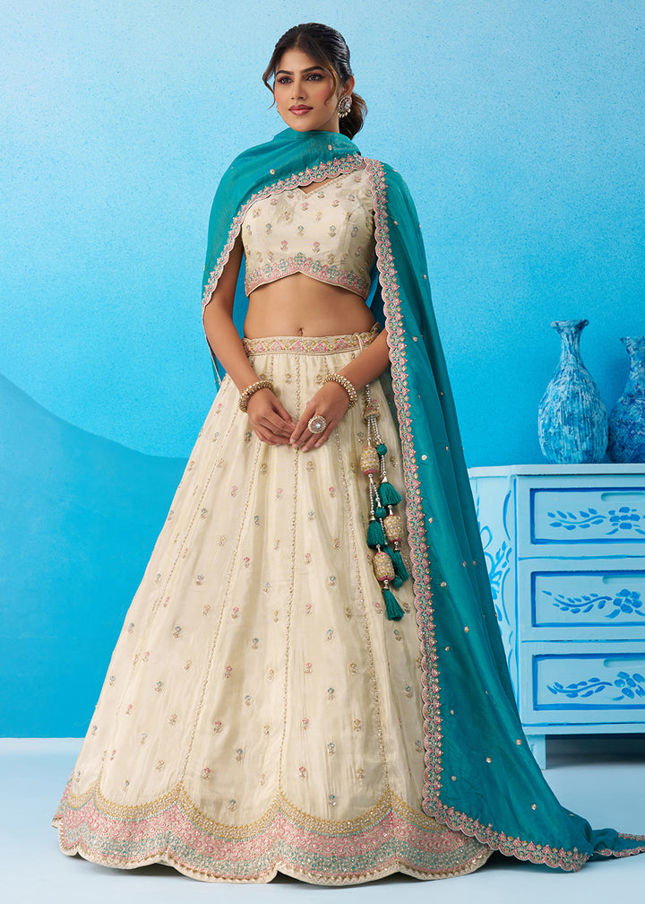 Buy Now Cream Premium Tissue Lehenga Choli with Rama Dupatta Online in US, UK, Canada, France, Italy, Germany, Sweden, Denmark, UAE & Worldwide at Empress.