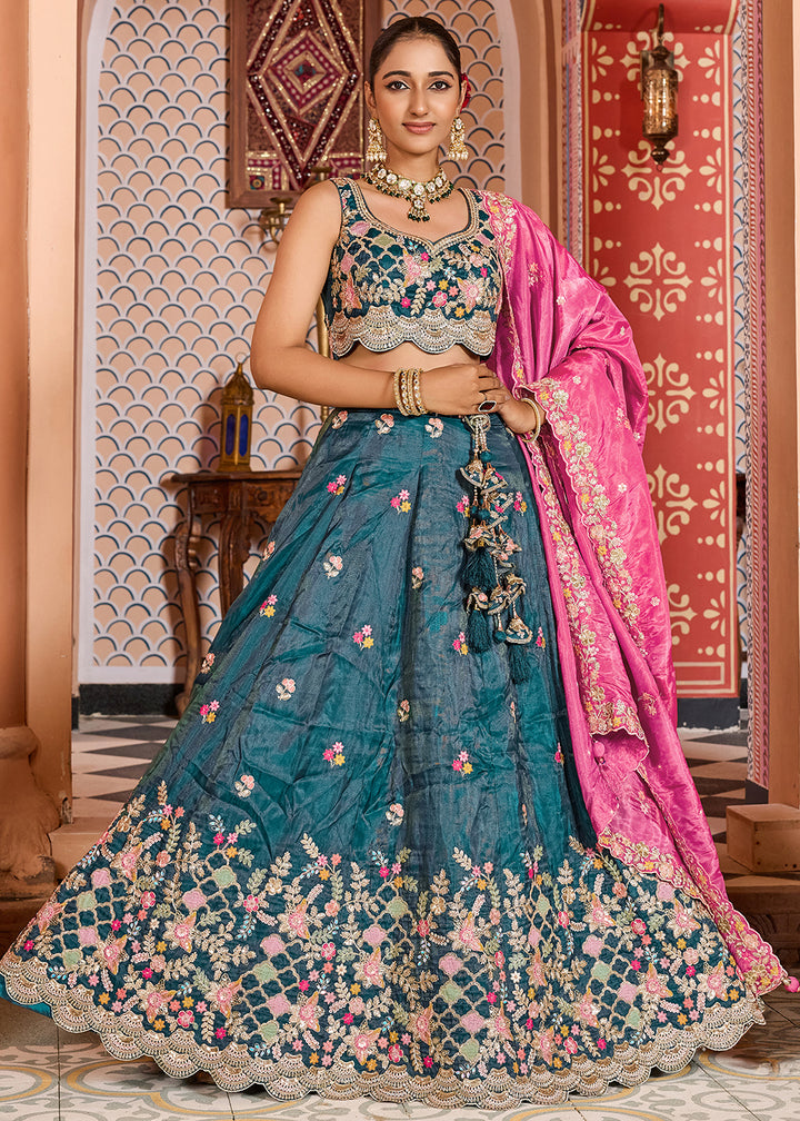Buy Now Teal Tissue Embroidered Lehenga Choli with Pink Dupatta Online in US, UK, Canada, France, Italy, Germany, Sweden, Greece, UAE & Worldwide at Empress.