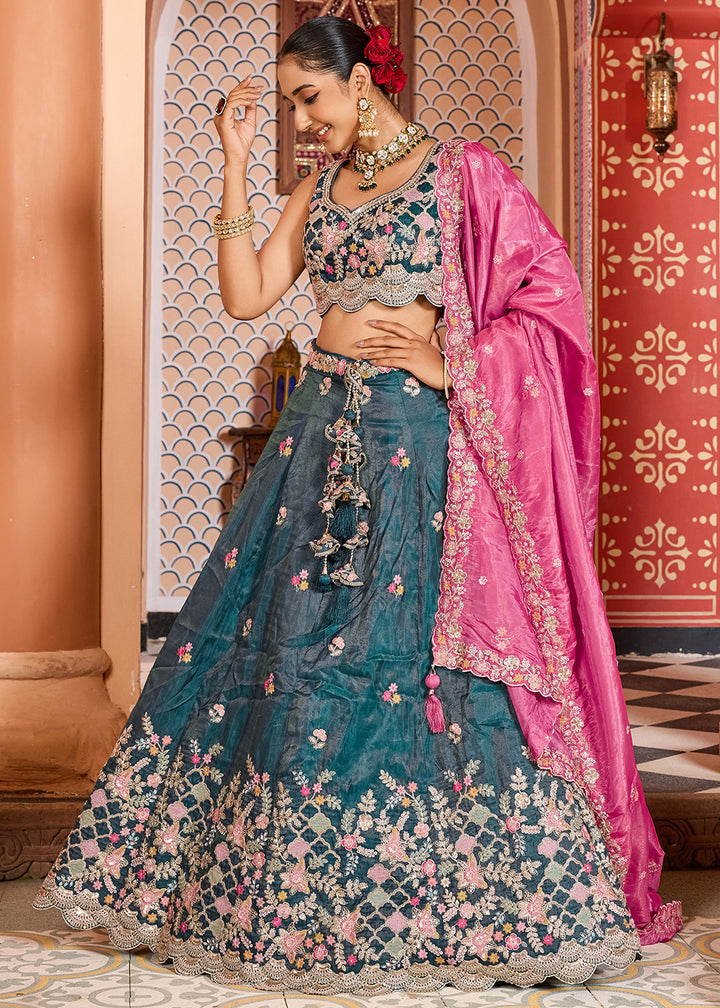 Buy Now Teal Tissue Embroidered Lehenga Choli with Pink Dupatta Online in US, UK, Canada, France, Italy, Germany, Sweden, Greece, UAE & Worldwide at Empress.