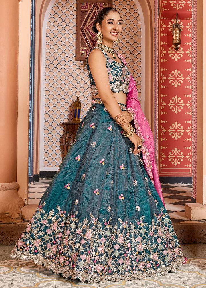 Buy Now Teal Tissue Embroidered Lehenga Choli with Pink Dupatta Online in US, UK, Canada, France, Italy, Germany, Sweden, Greece, UAE & Worldwide at Empress.