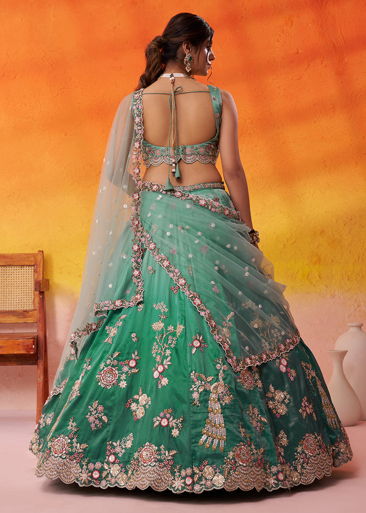 Buy Now Green Heavy Tissue Pre Wedding Party Lehenga Choli Online in US, UK, Canada, France, Germany, Sweden, Greece, UAE, Denmark & Worldwide at Empress.