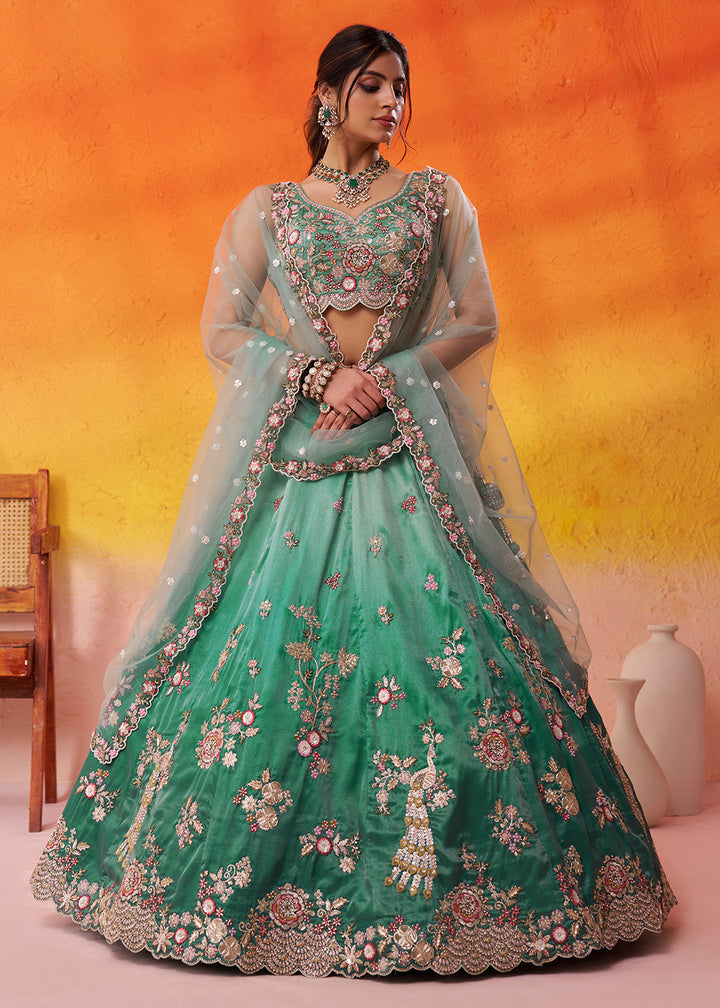 Buy Now Green Heavy Tissue Pre Wedding Party Lehenga Choli Online in US, UK, Canada, France, Germany, Sweden, Greece, UAE, Denmark & Worldwide at Empress.