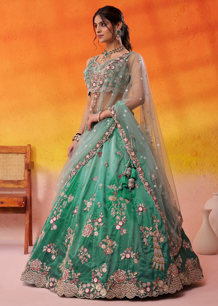Buy Now Green Heavy Tissue Pre Wedding Party Lehenga Choli Online in US, UK, Canada, France, Germany, Sweden, Greece, UAE, Denmark & Worldwide at Empress.