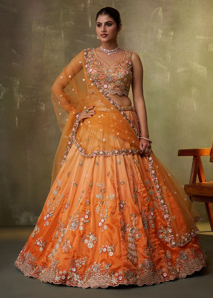 Buy Now Orange Heavy Tissue Pre Wedding Party Lehenga Choli Online in US, UK, Canada, France, Germany, Sweden, Greece, UAE, Denmark & Worldwide at Empress.