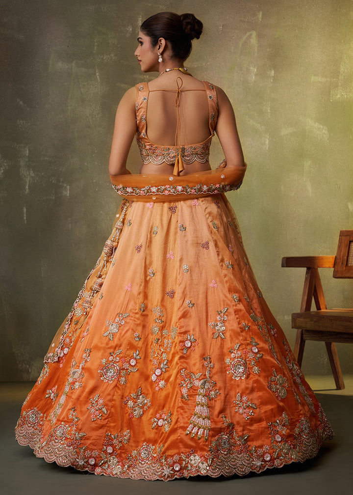 Buy Now Orange Heavy Tissue Pre Wedding Party Lehenga Choli Online in US, UK, Canada, France, Germany, Sweden, Greece, UAE, Denmark & Worldwide at Empress.