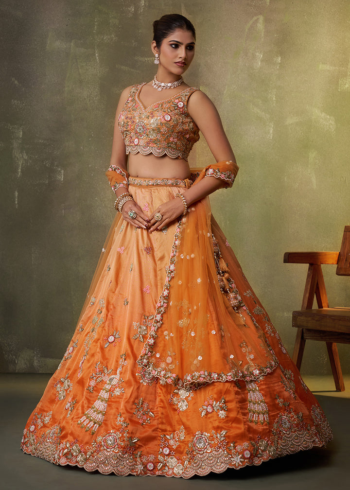 Buy Now Orange Heavy Tissue Pre Wedding Party Lehenga Choli Online in US, UK, Canada, France, Germany, Sweden, Greece, UAE, Denmark & Worldwide at Empress.