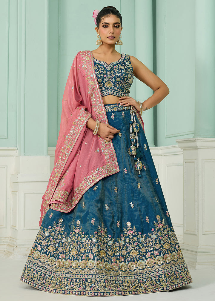 Buy Now Silk Teal Heavy Embroidered Wedding Lehenga Choli Online in US, UK, Canada, France, Italy, Germany, Sweden, Denmark, Greece, UAE & Worldwide at Empress.