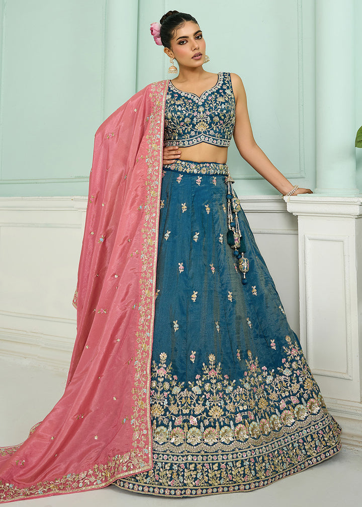 Buy Now Silk Teal Heavy Embroidered Wedding Lehenga Choli Online in US, UK, Canada, France, Italy, Germany, Sweden, Denmark, Greece, UAE & Worldwide at Empress.
