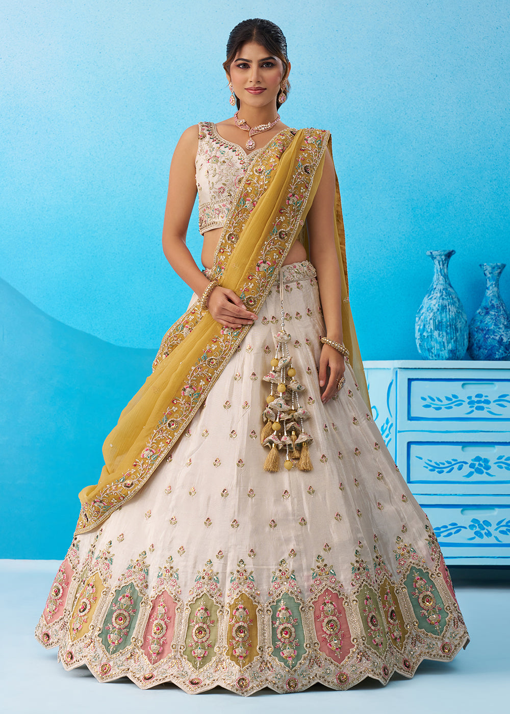 Buy Now Cream Multicolor Patch Work Lehenga Choli with Mustard Dupatta Online in US, UK, Canada, France, Italy, Germany, Sweden, Denmark & Worldwide at Empress.