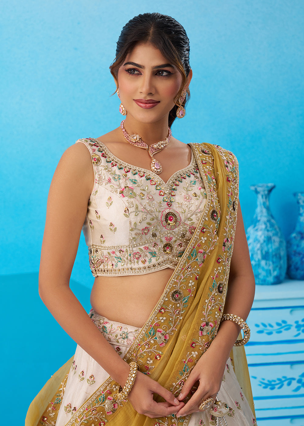 Buy Now Cream Multicolor Patch Work Lehenga Choli with Mustard Dupatta Online in US, UK, Canada, France, Italy, Germany, Sweden, Denmark & Worldwide at Empress.