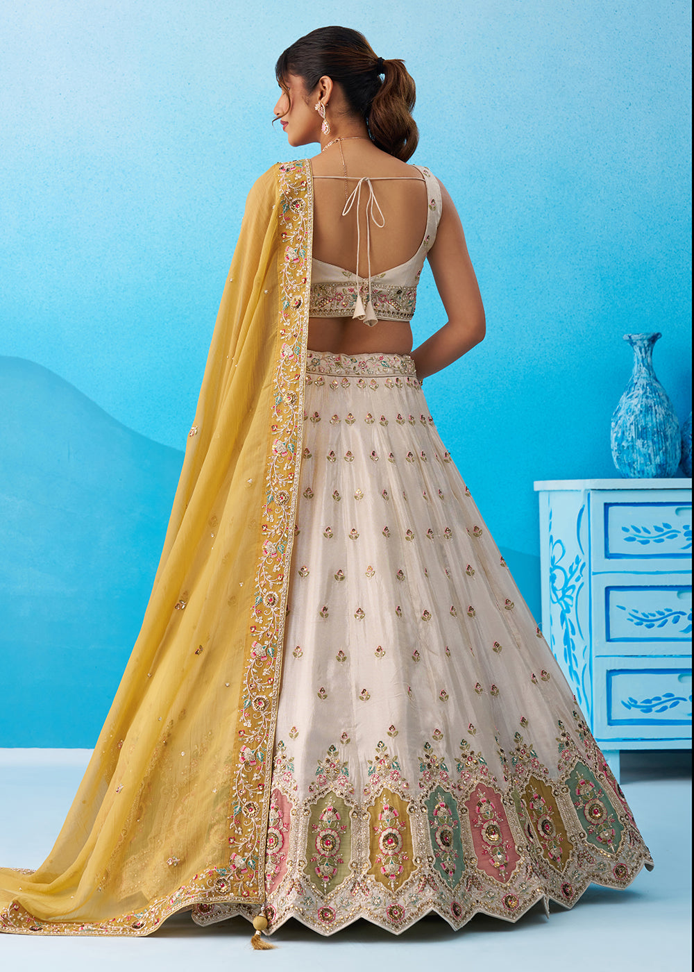 Buy Now Cream Multicolor Patch Work Lehenga Choli with Mustard Dupatta Online in US, UK, Canada, France, Italy, Germany, Sweden, Denmark & Worldwide at Empress.