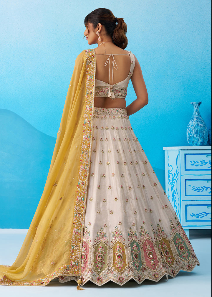 Buy Now Cream Multicolor Patch Work Lehenga Choli with Mustard Dupatta Online in US, UK, Canada, France, Italy, Germany, Sweden, Denmark & Worldwide at Empress.