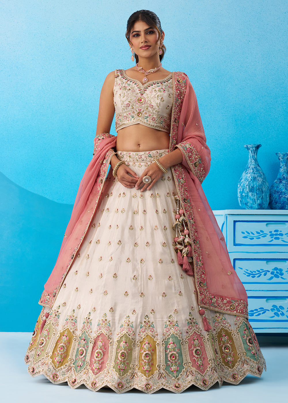 Buy Now Cream Multicolor Patch Work Lehenga Choli with Pink Dupatta Online in US, UK, Canada, France, Italy, Germany, Sweden, Denmark & Worldwide at Empress.